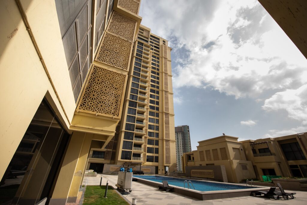 The pool deck and townhomes at the base of Emaar Coral Towers (Emaar Pakistan photo)