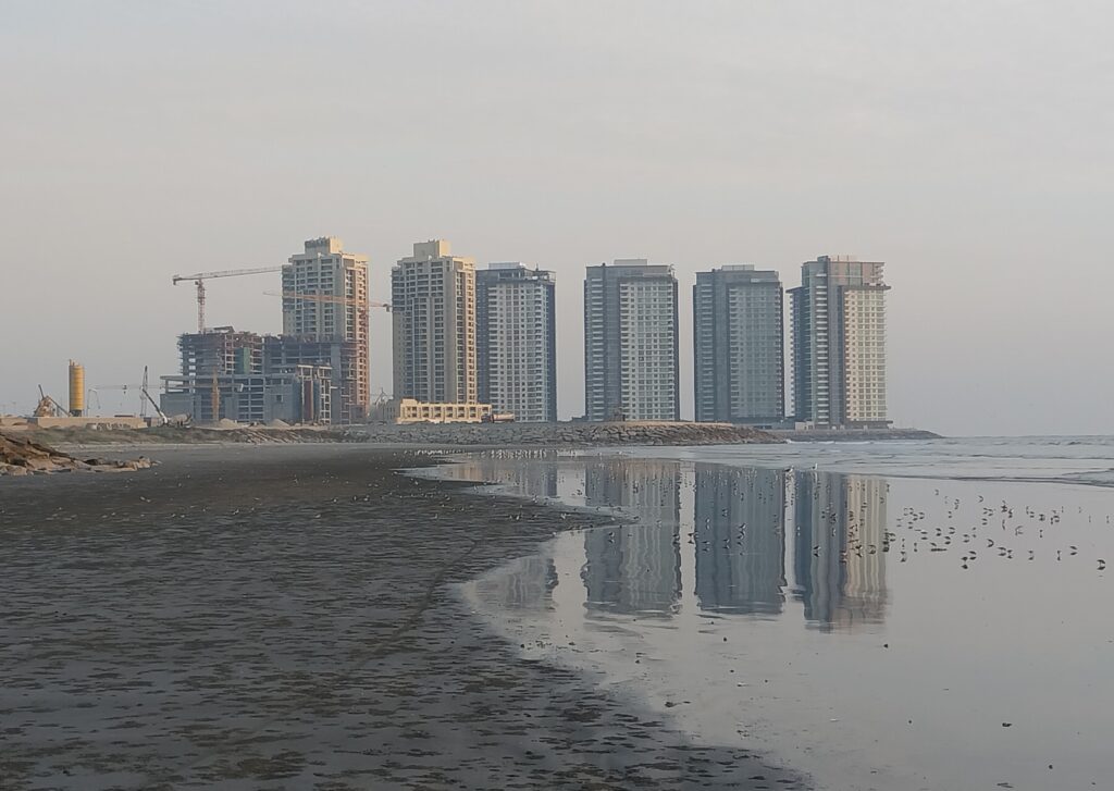 Emaar Oceanfront's towers seen from the beach in December 2022